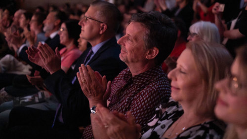 Audience members at a performance