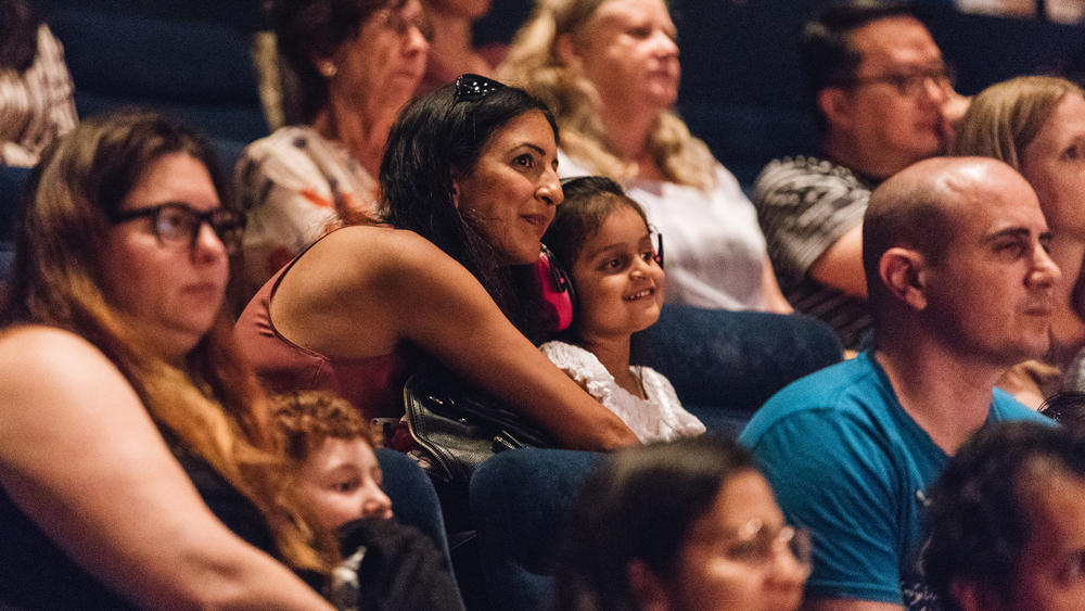 Audience members at a YOU dance performance