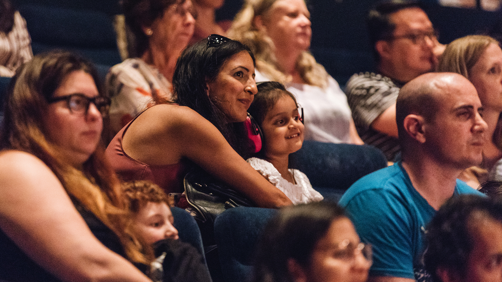 Audience members at a YOU dance performance