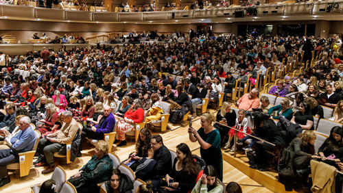 Audience members at a performance